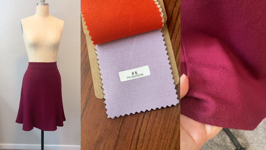 Close up of a 100% wool crepe fabric swatch showing the premium pebbled texture for a luxury winter wardrobe