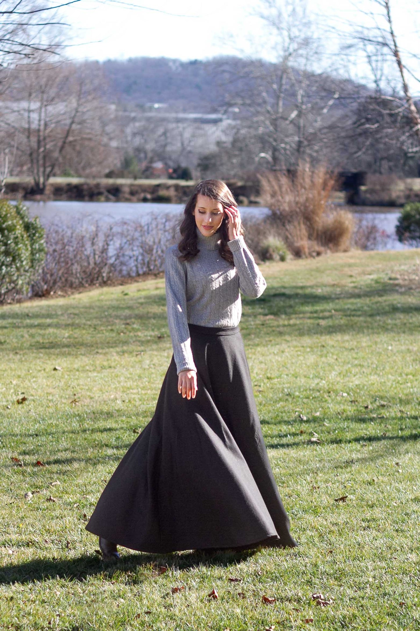 Woman twirling in Black long wool skirt