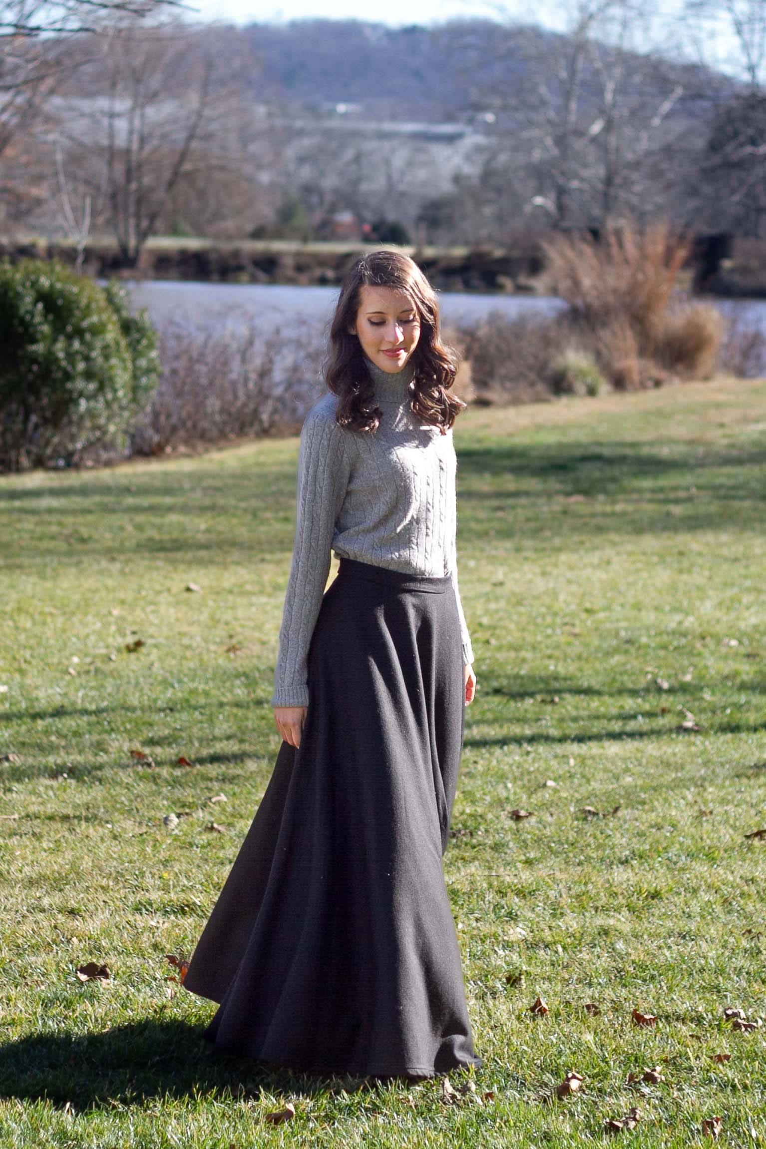 woman walking in black wool maxi skirt