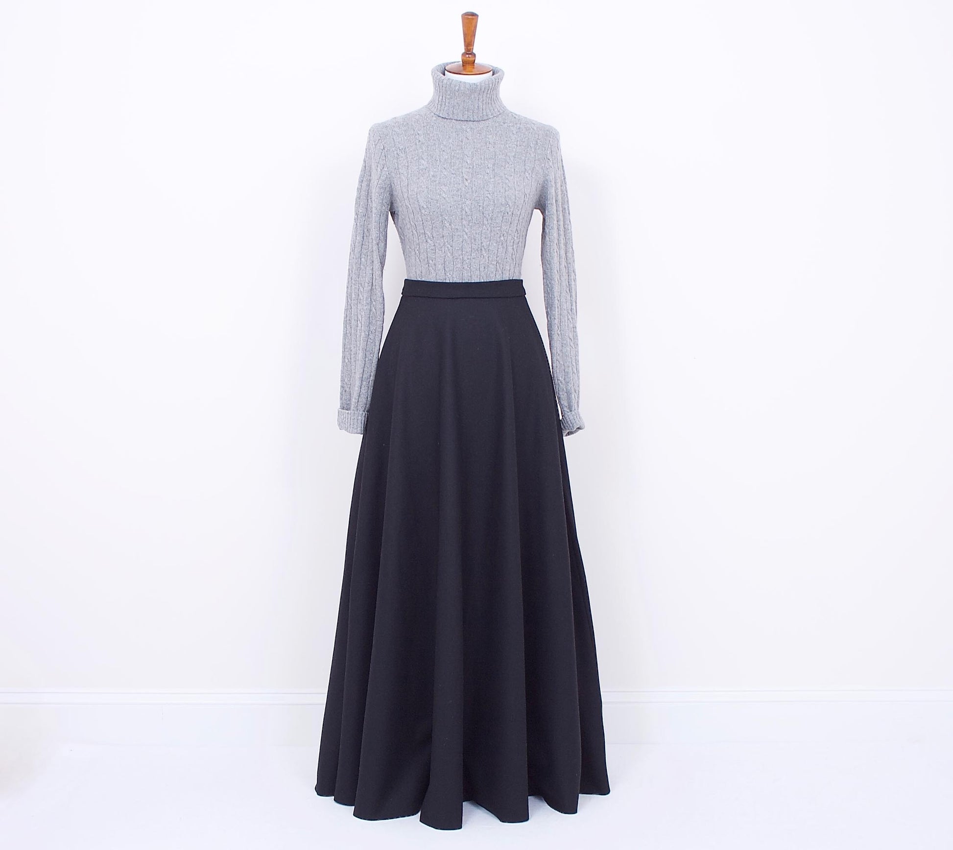 black wool maxi skirt on a mannequin